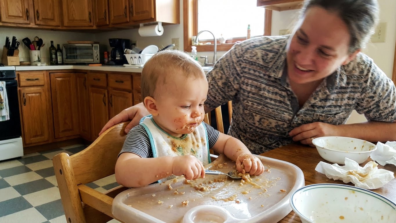 Variety of first foods arranged on baby plate